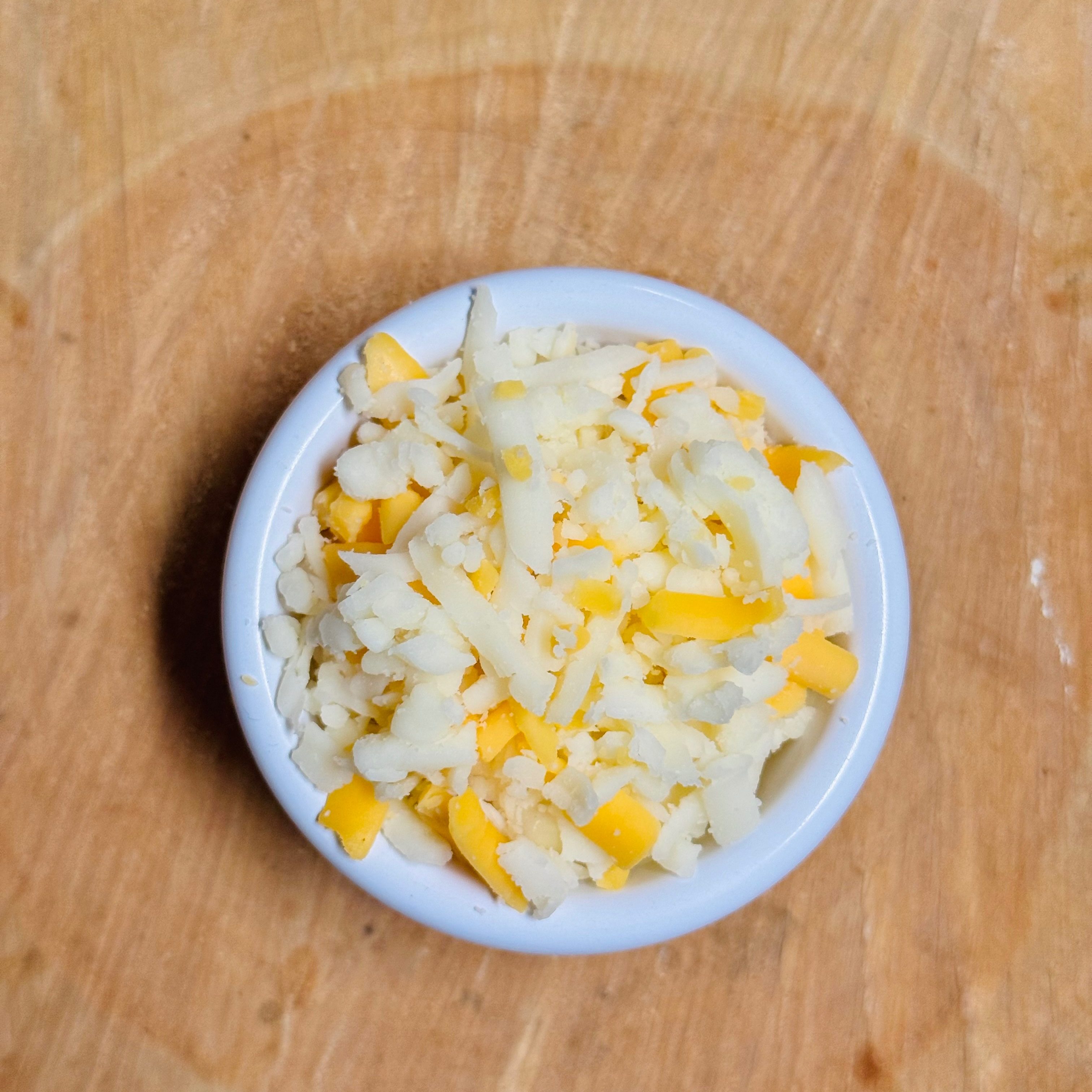 Side of shredded cheese.